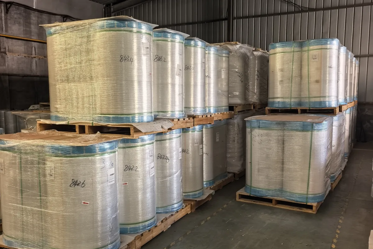 Protected film rolls arranged on pallets